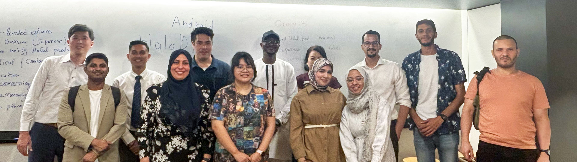 An international project team at a whiteboard of software notes