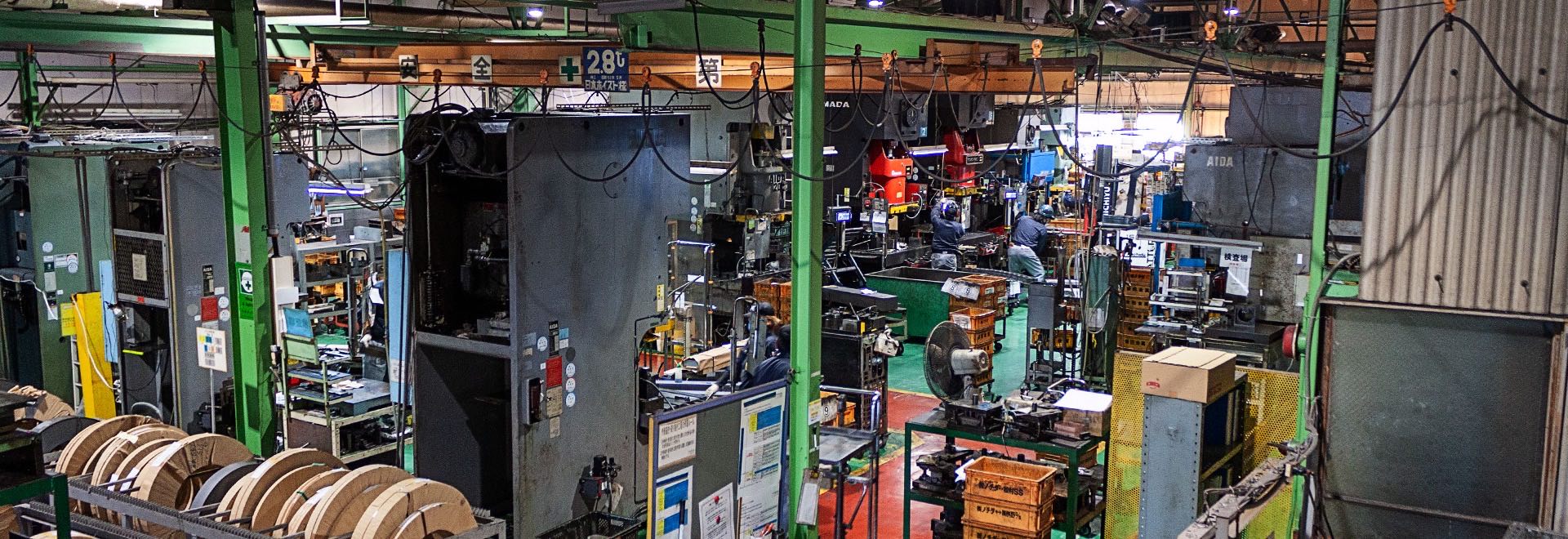 A wide aisle running between machines on a factory floor