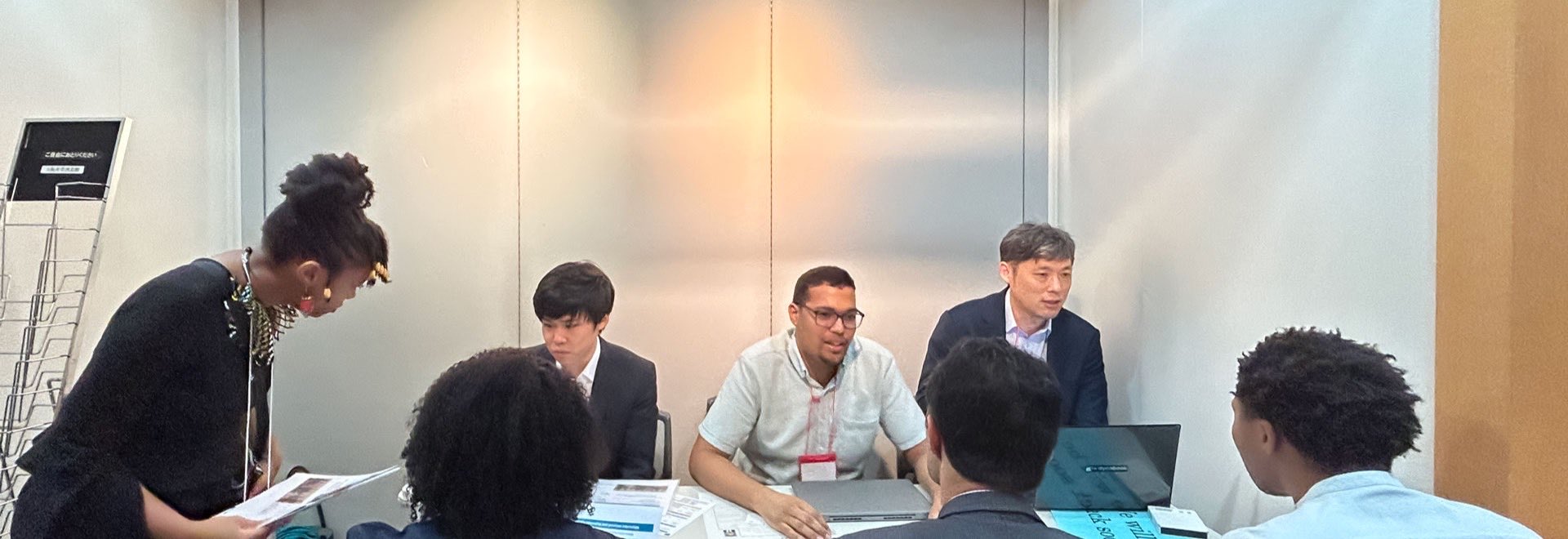 Colleagues from several countries meeting around a table