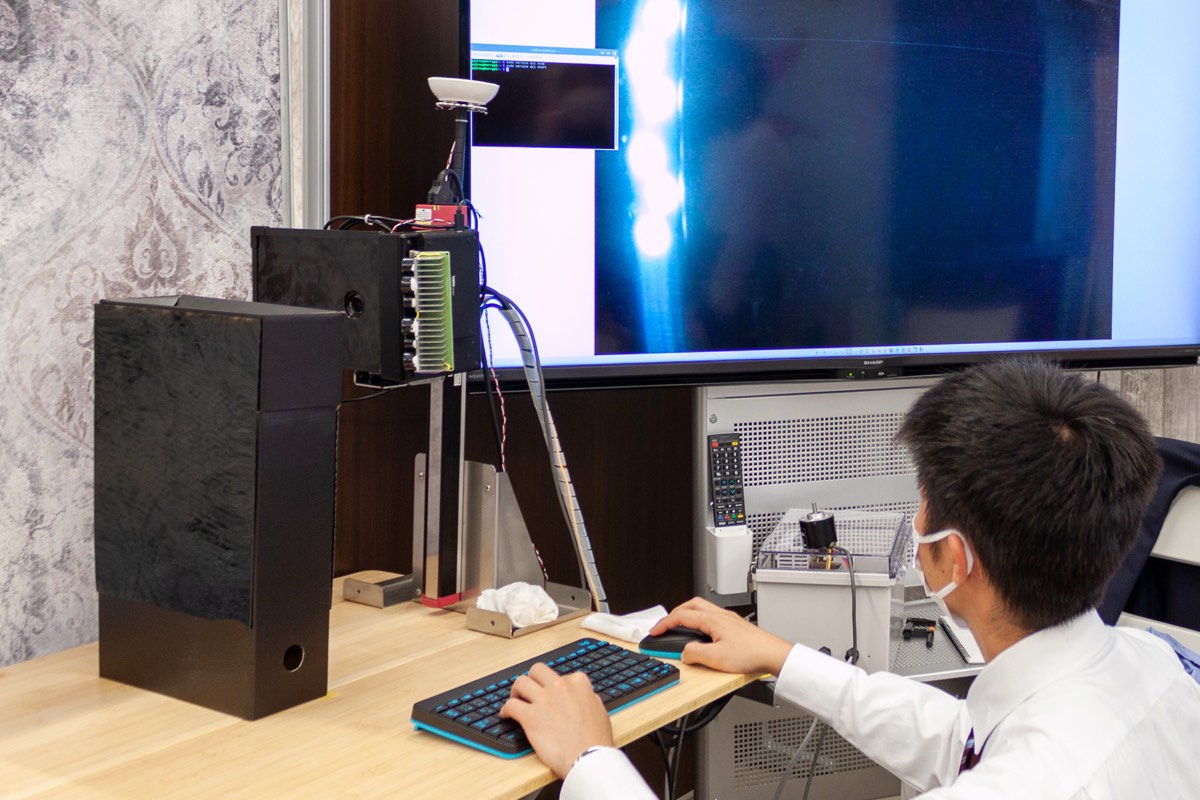An eftax engineer at work on a development machine